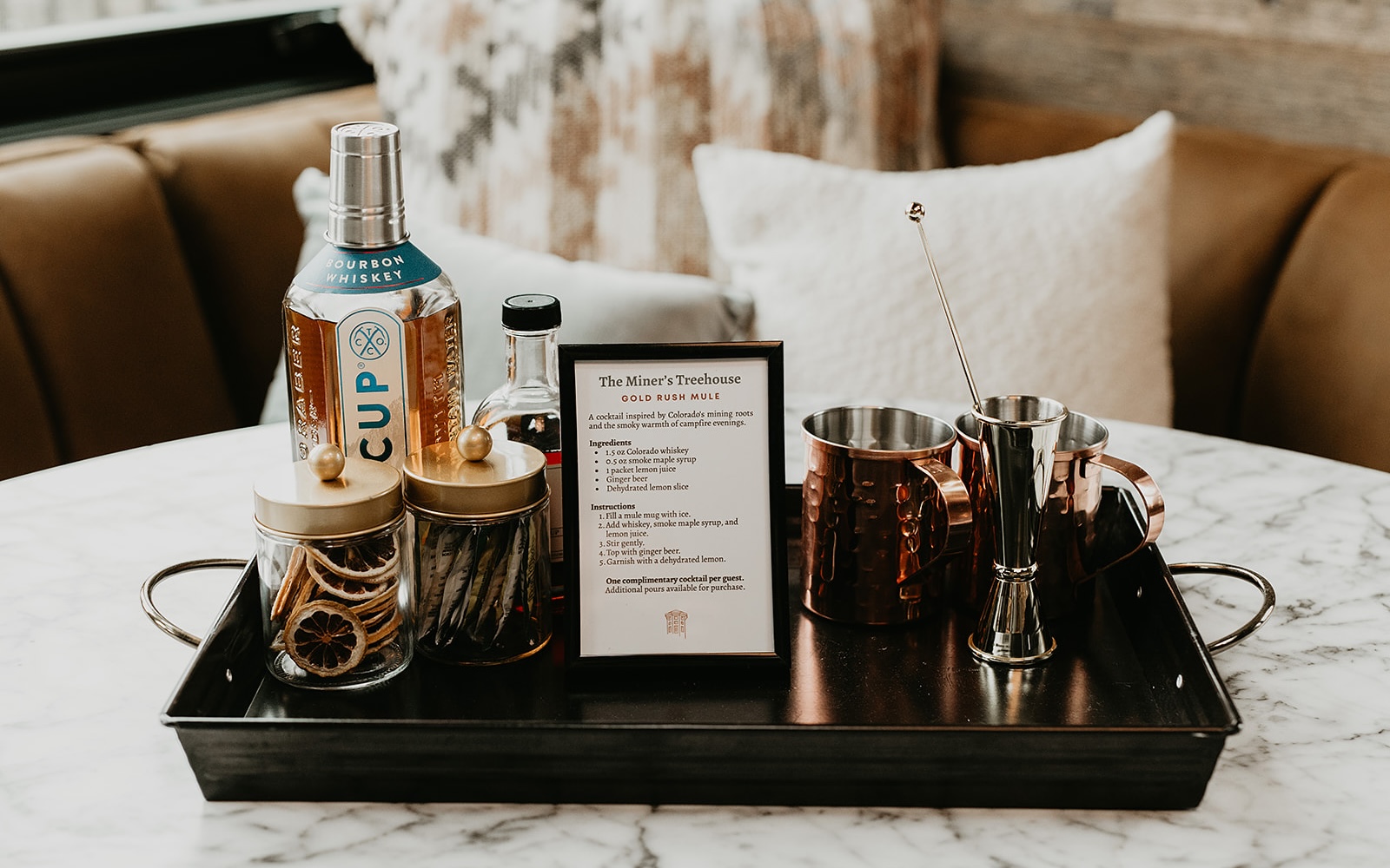 A mule cocktail recipe and ingredients on a tray