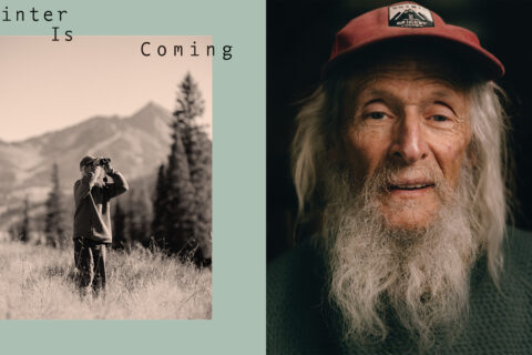 Billy Barr peering through binocs; a portrait of Billy Barr