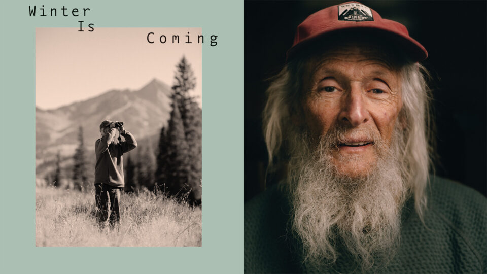 Billy Barr peering through binocs; a portrait of Billy Barr