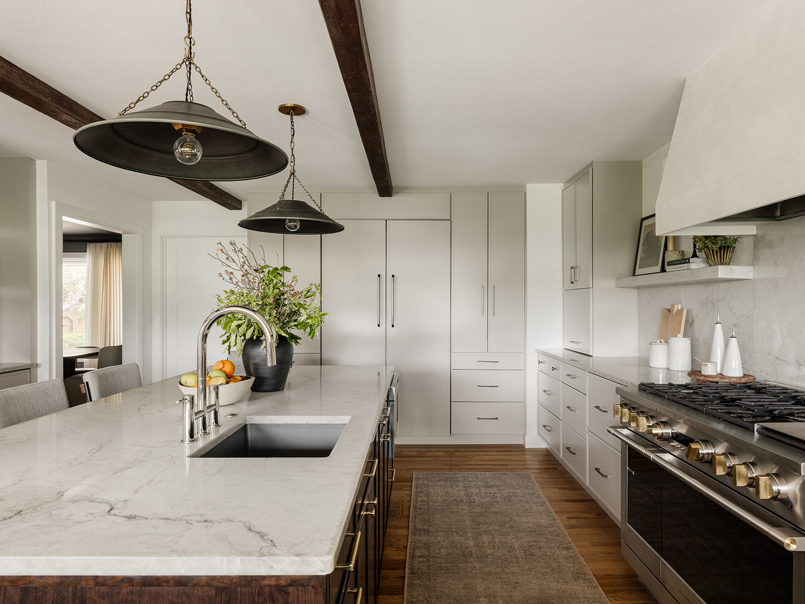 White kitchen with all-white refrigerator and island