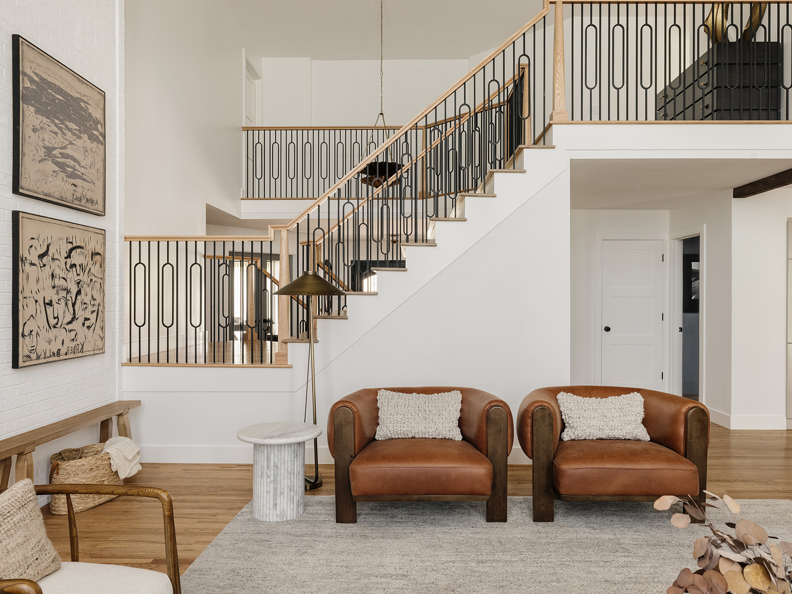 Seating area with a staircase behind it