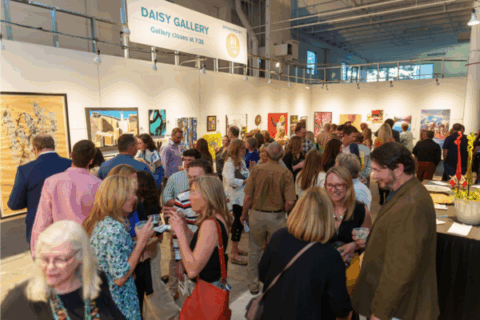 A crowd of people in an art gallery