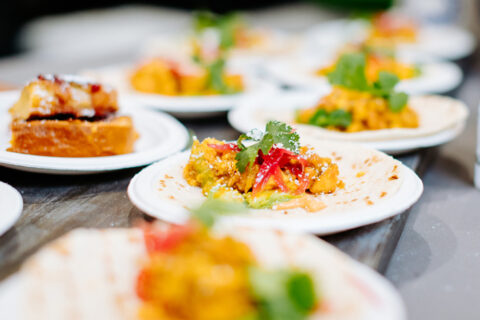 Small plates of food at a food event
