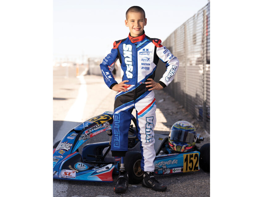 Pedro Cueto in front of his race car