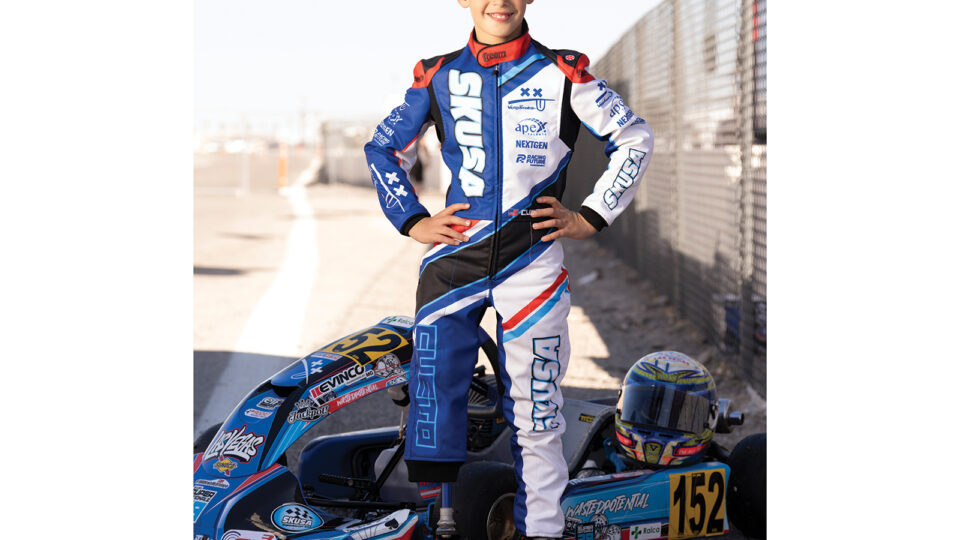 Pedro Cueto in front of his race car