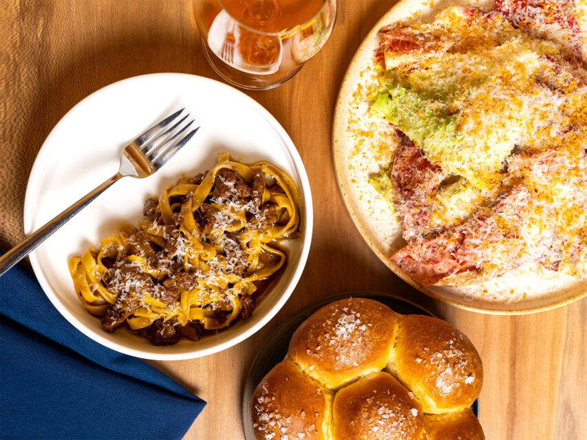 Merguez tagliatelle; rising brioche rolls; chicory “Caesar salad”