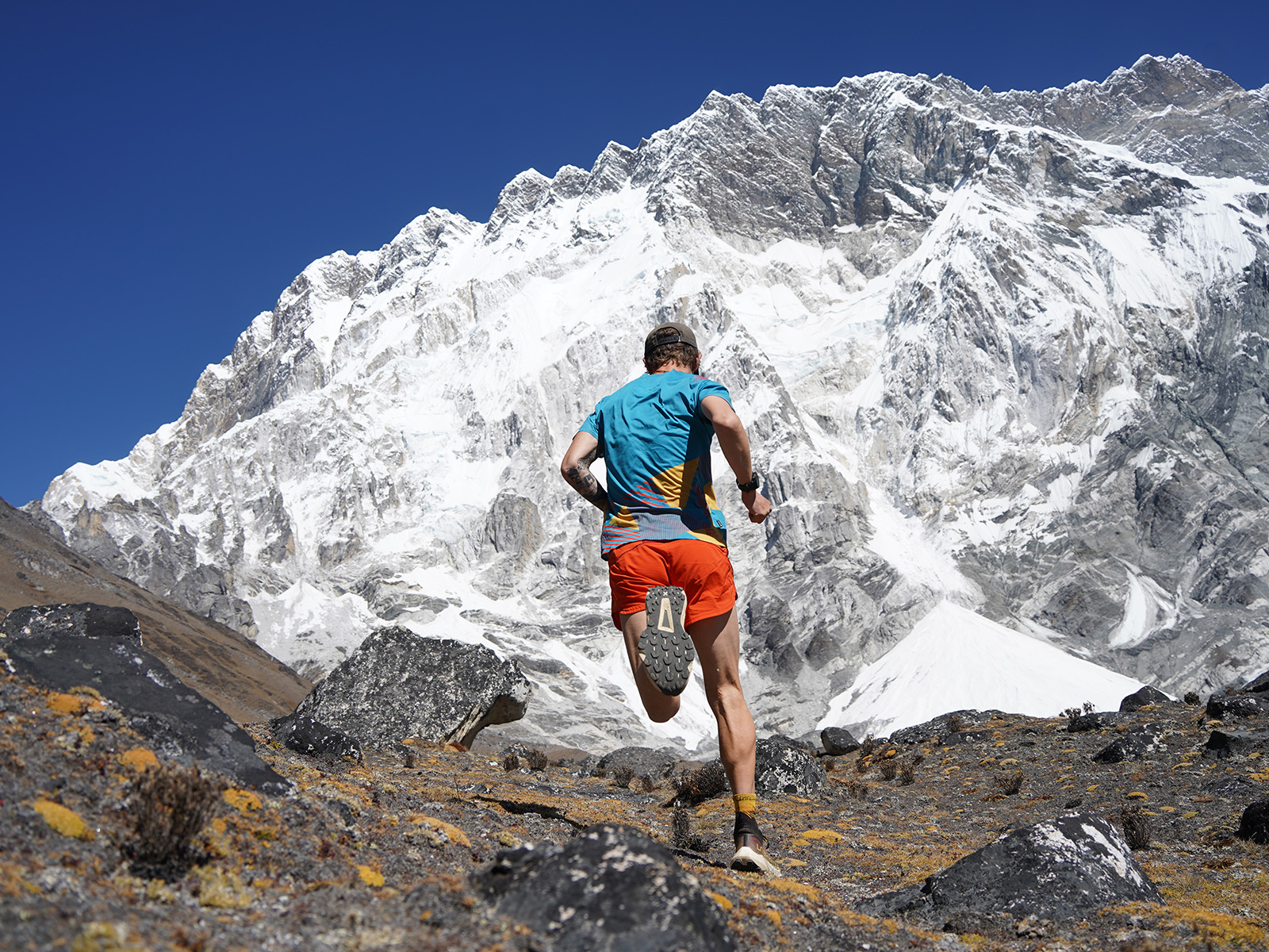 Tyler runs up a mountain