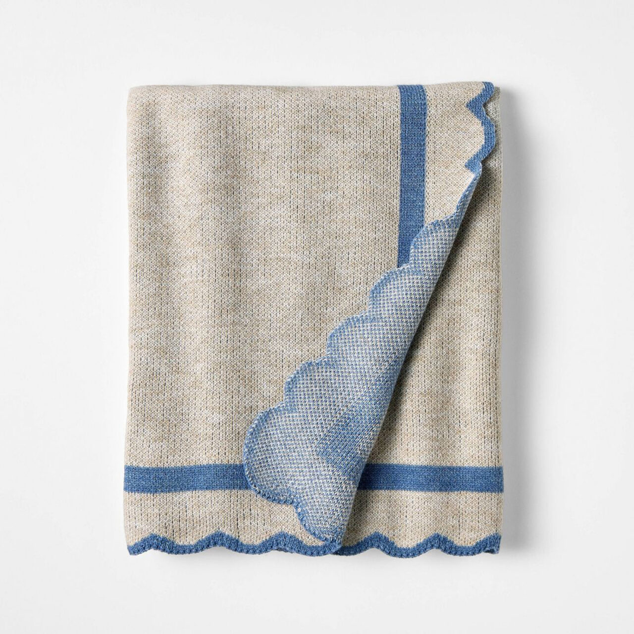 Blue and white scalloped throw