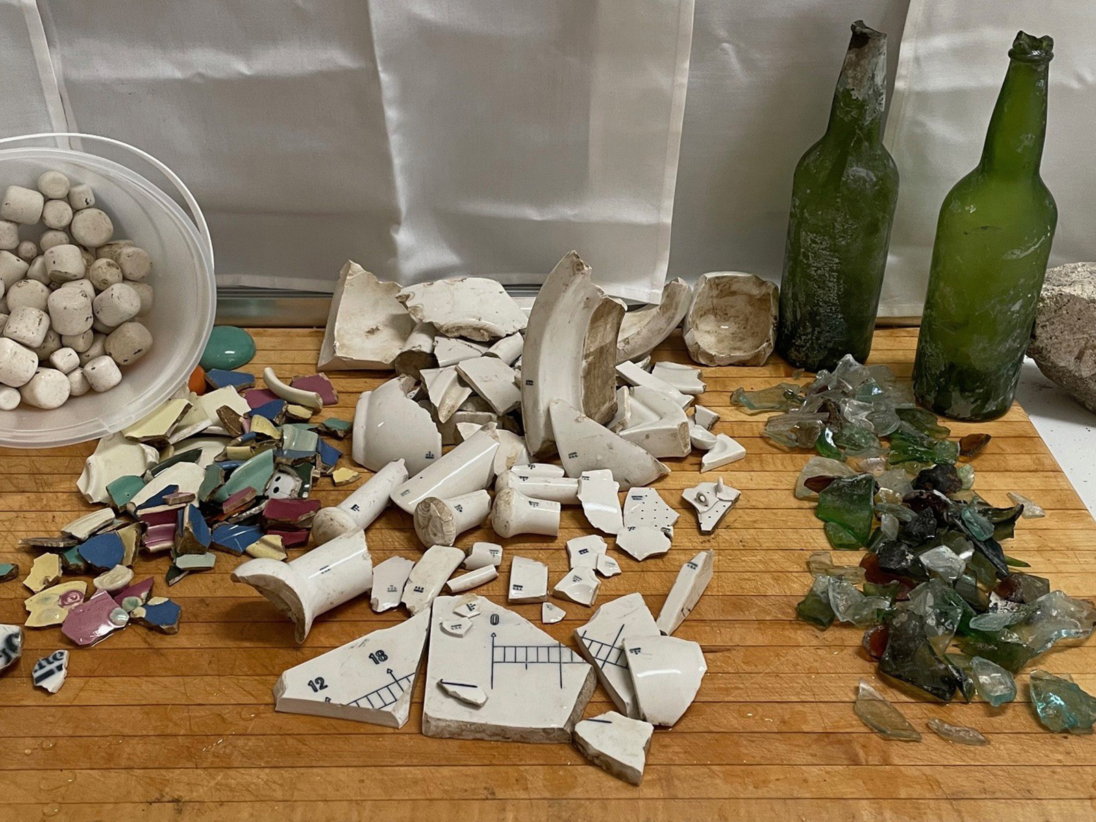 Shards of old Coors dinnerware, labware, and glassware