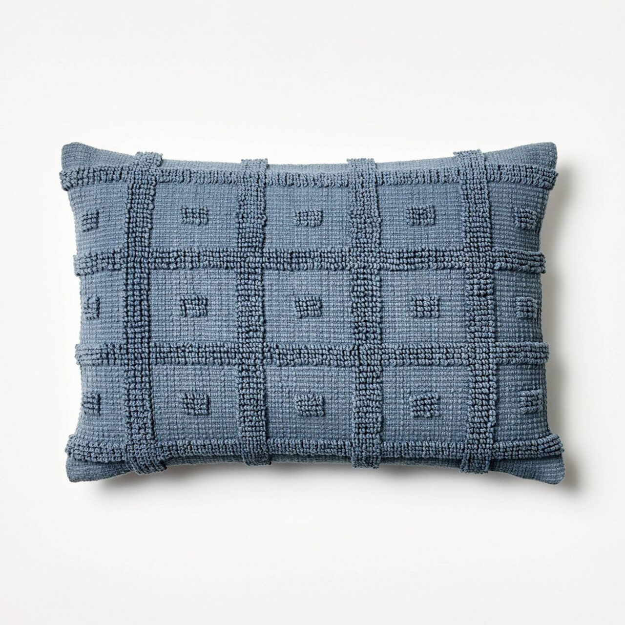 Blue tufted oblong pillow