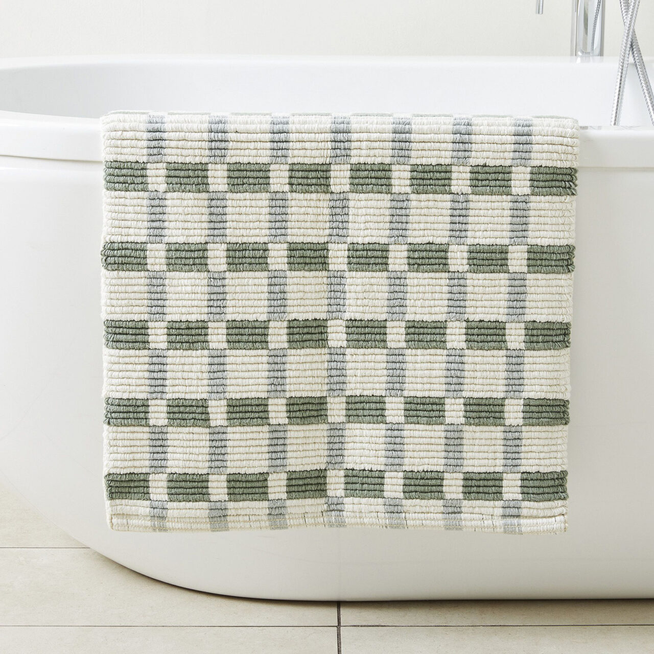 green and white bath mat