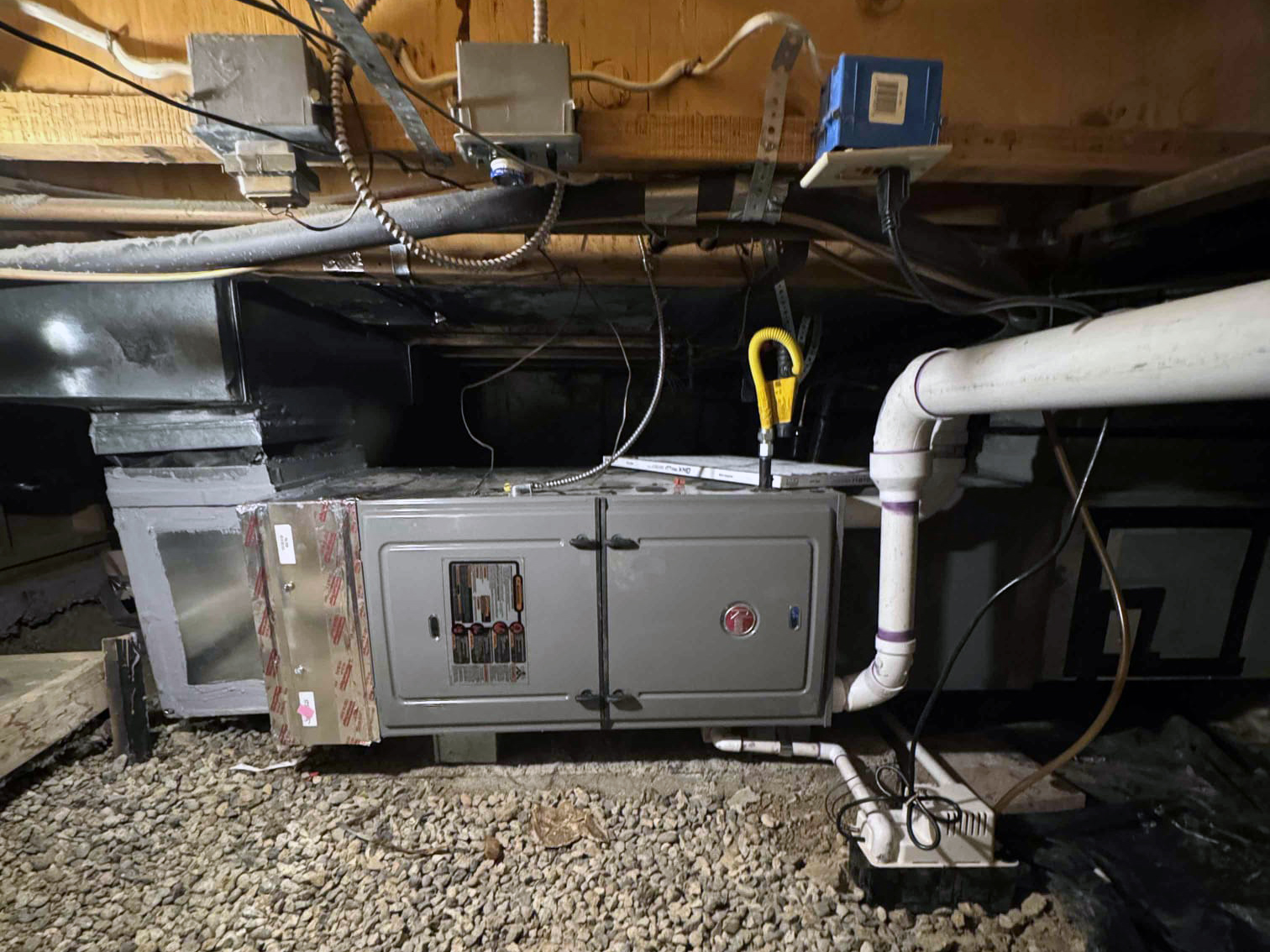 A furnace in a crawlspace
