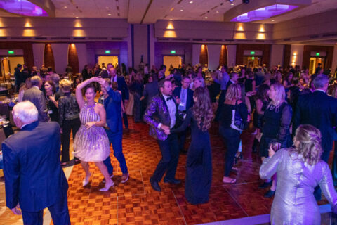 A room filled with people dancing.