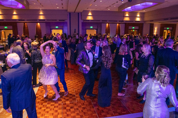 A room filled with people dancing.