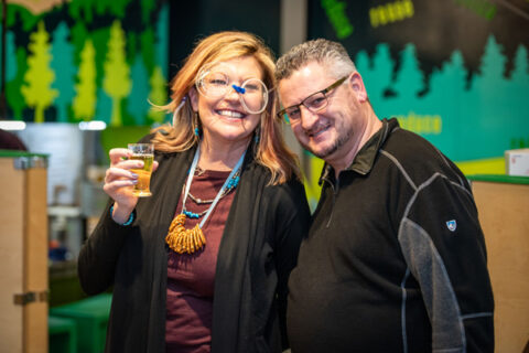 A woman and a man standing together at an event.
