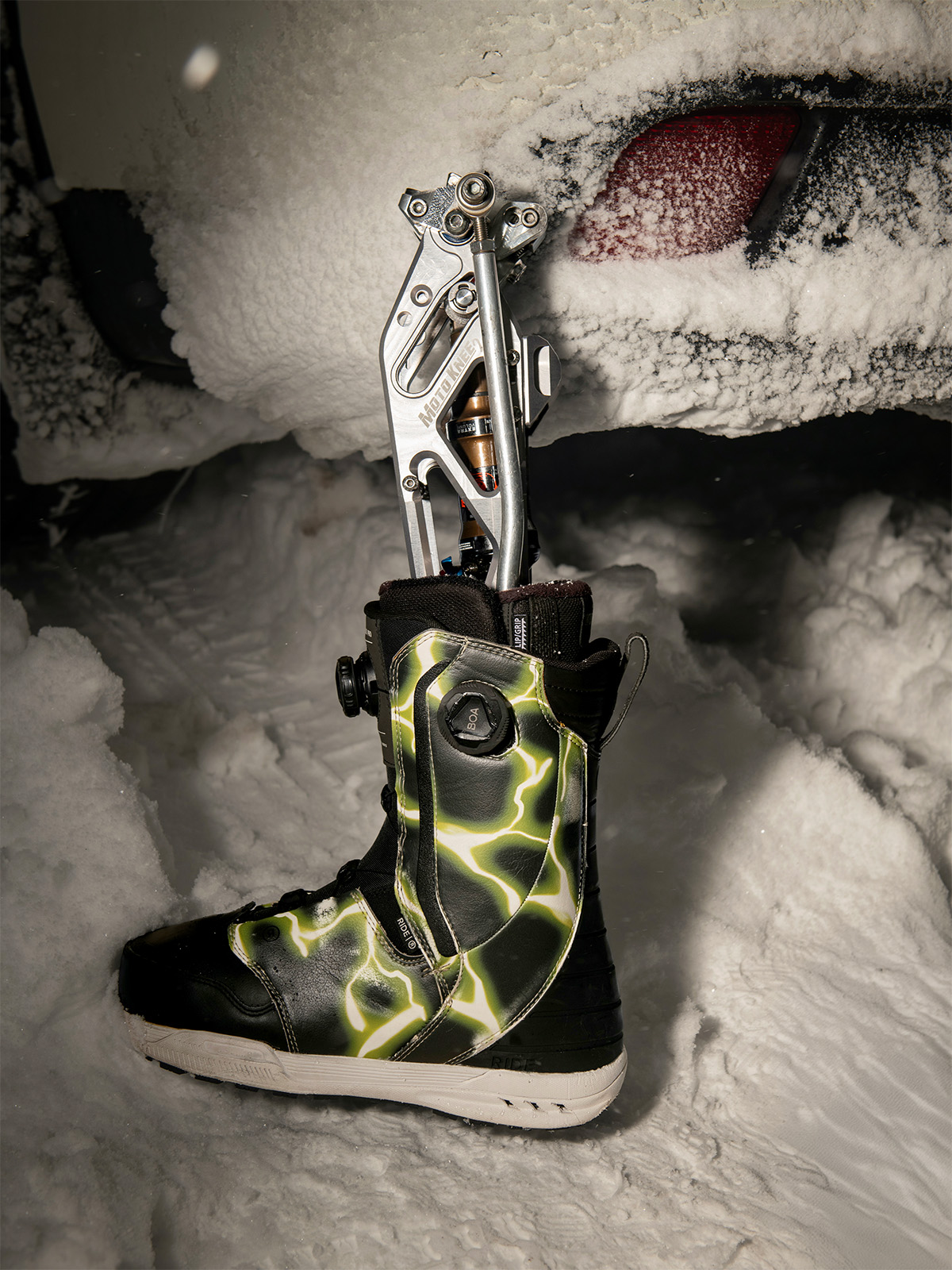 A prosthetic leg in a snowboard boot