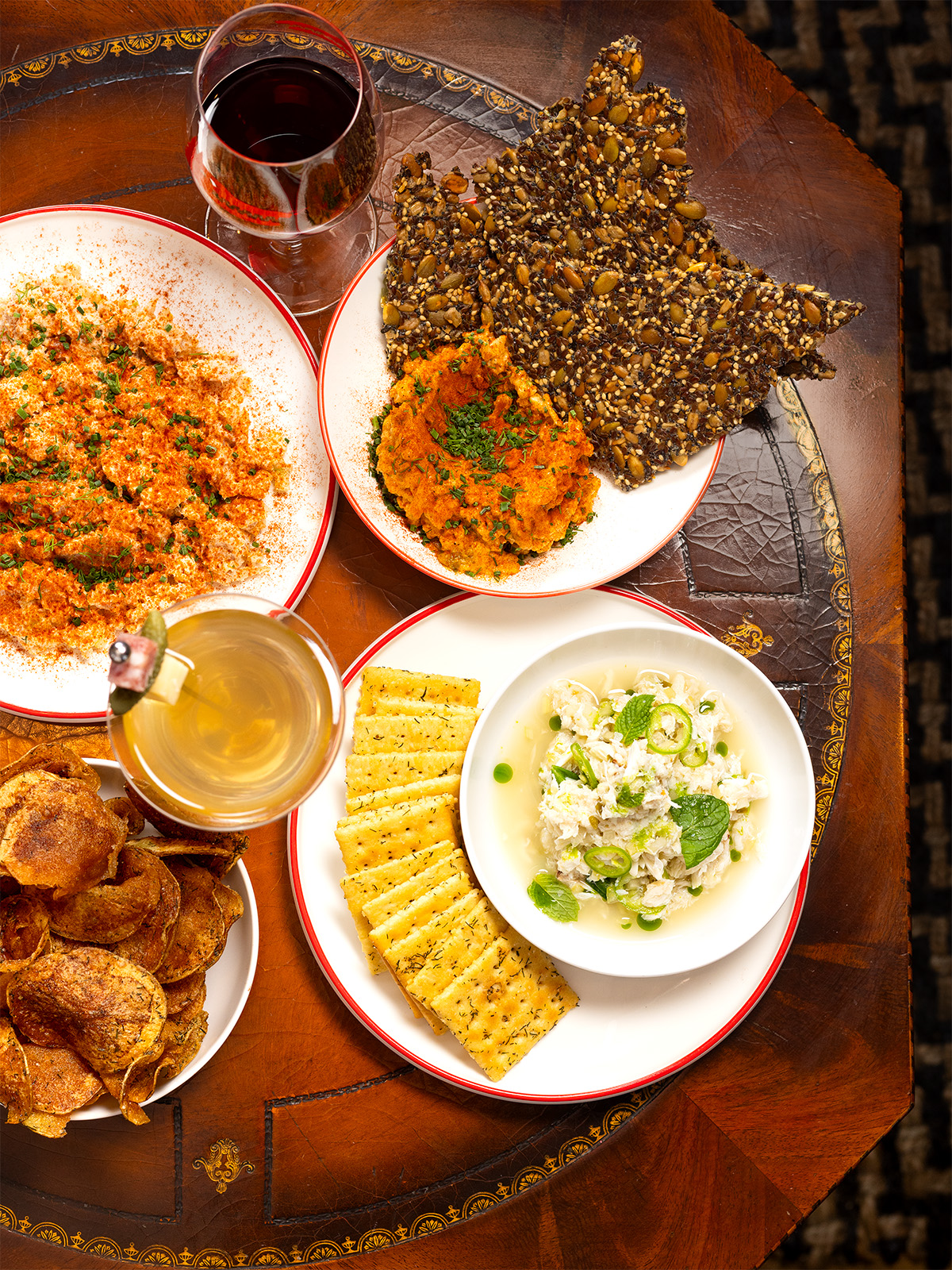 Pimento cheese and seeded crackers, smoked catfish dip with potato chips, and crab salad with saltines at Rougarou in Denver