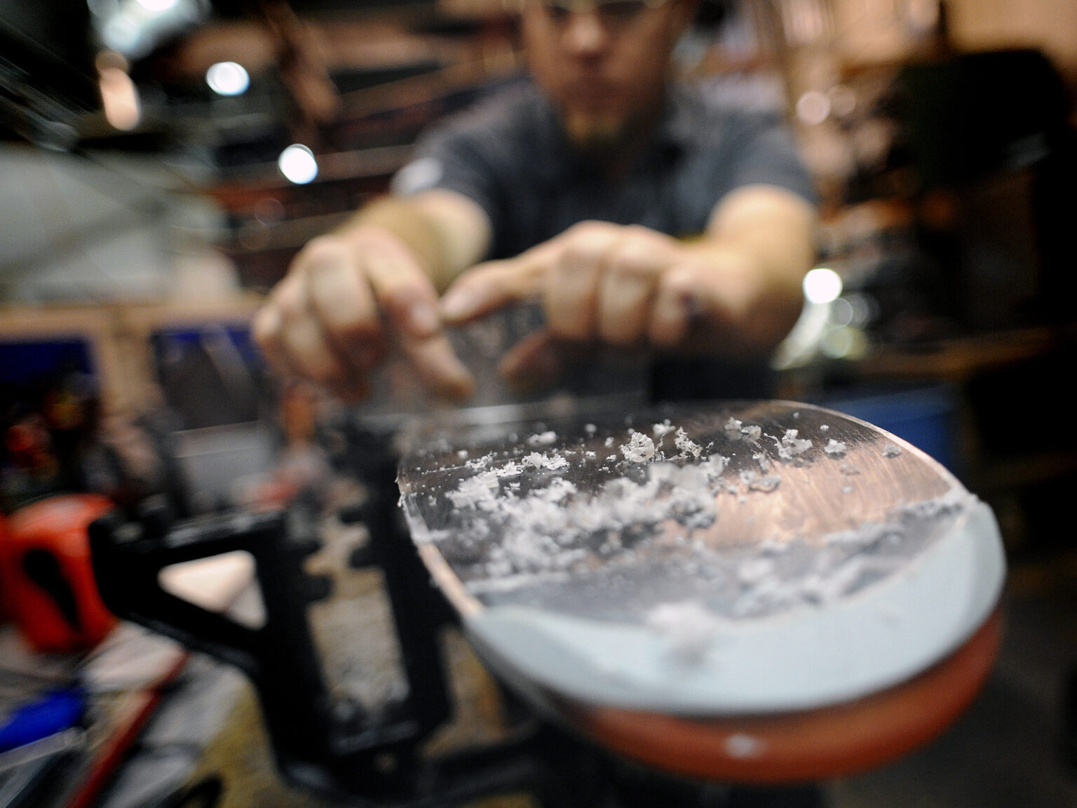 Scraping wax off a ski