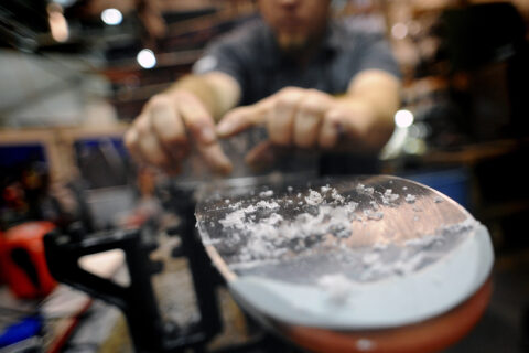 Scraping wax off a ski