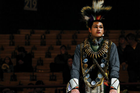A dancer waits to perform at the Denver March Powwow