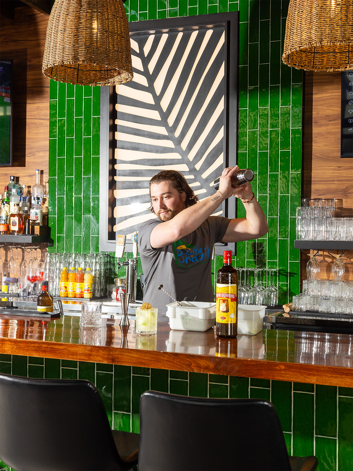 A bartender shakes a cocktail at Little Brazil in Wheat Ridge