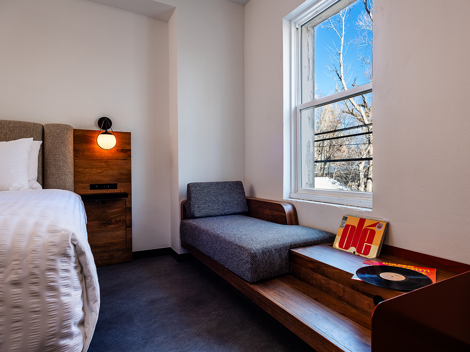 Sitting area and vinyl collection in a guest room