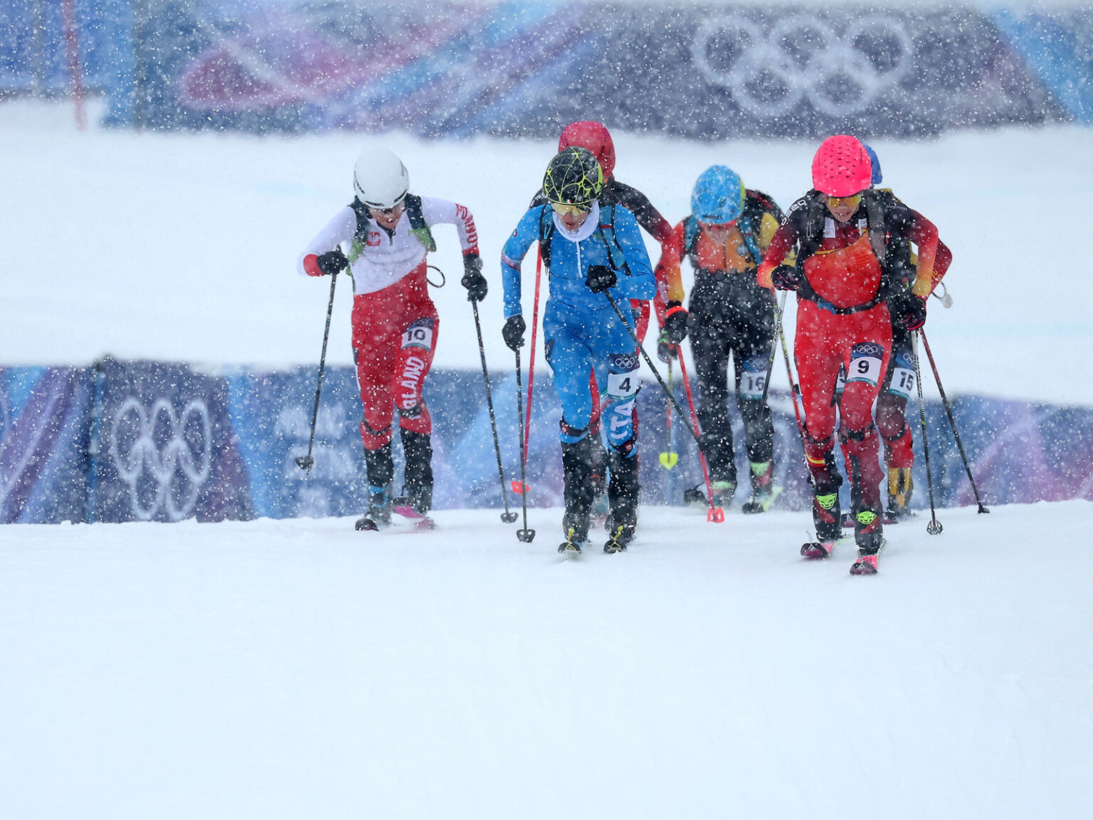 Women uphill during Olympic ski mountaineering sprint event