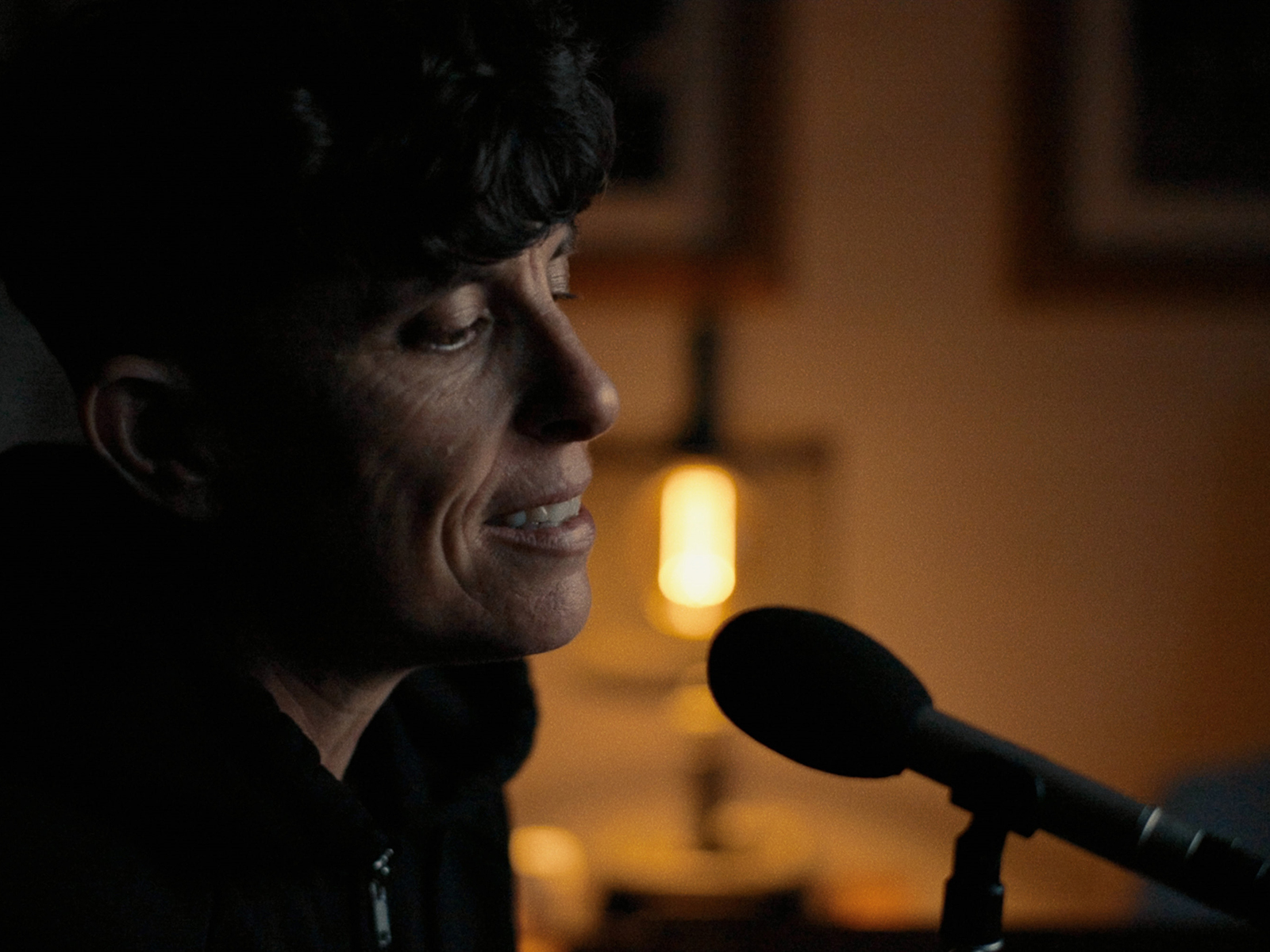 Andrea Gibson at a microphone