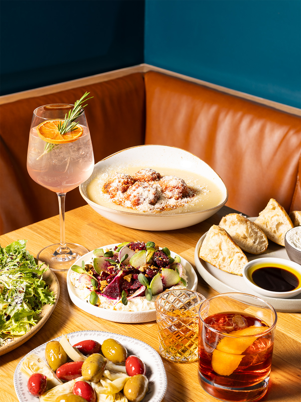 A spread of appetizers, mains, and beverages from the Greenwich