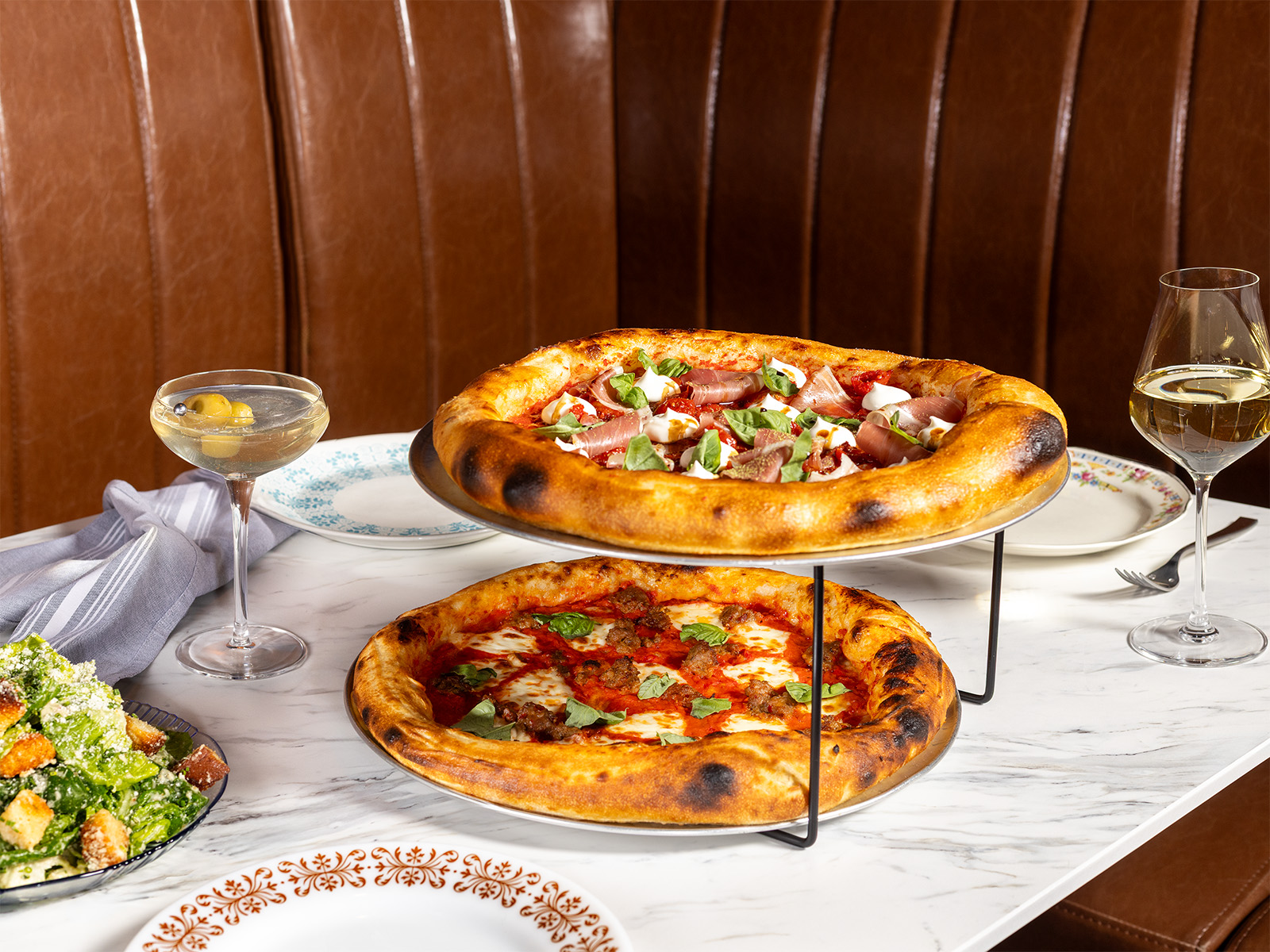 Tiered pizzas on a table