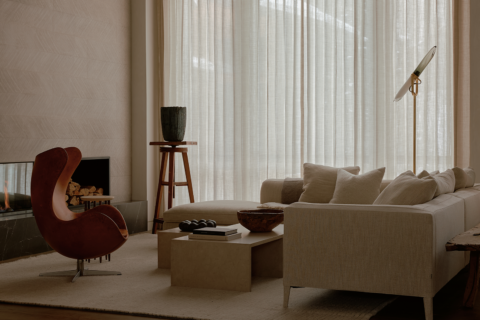 Minimalist living room with a white sofa and earth-tone furniture