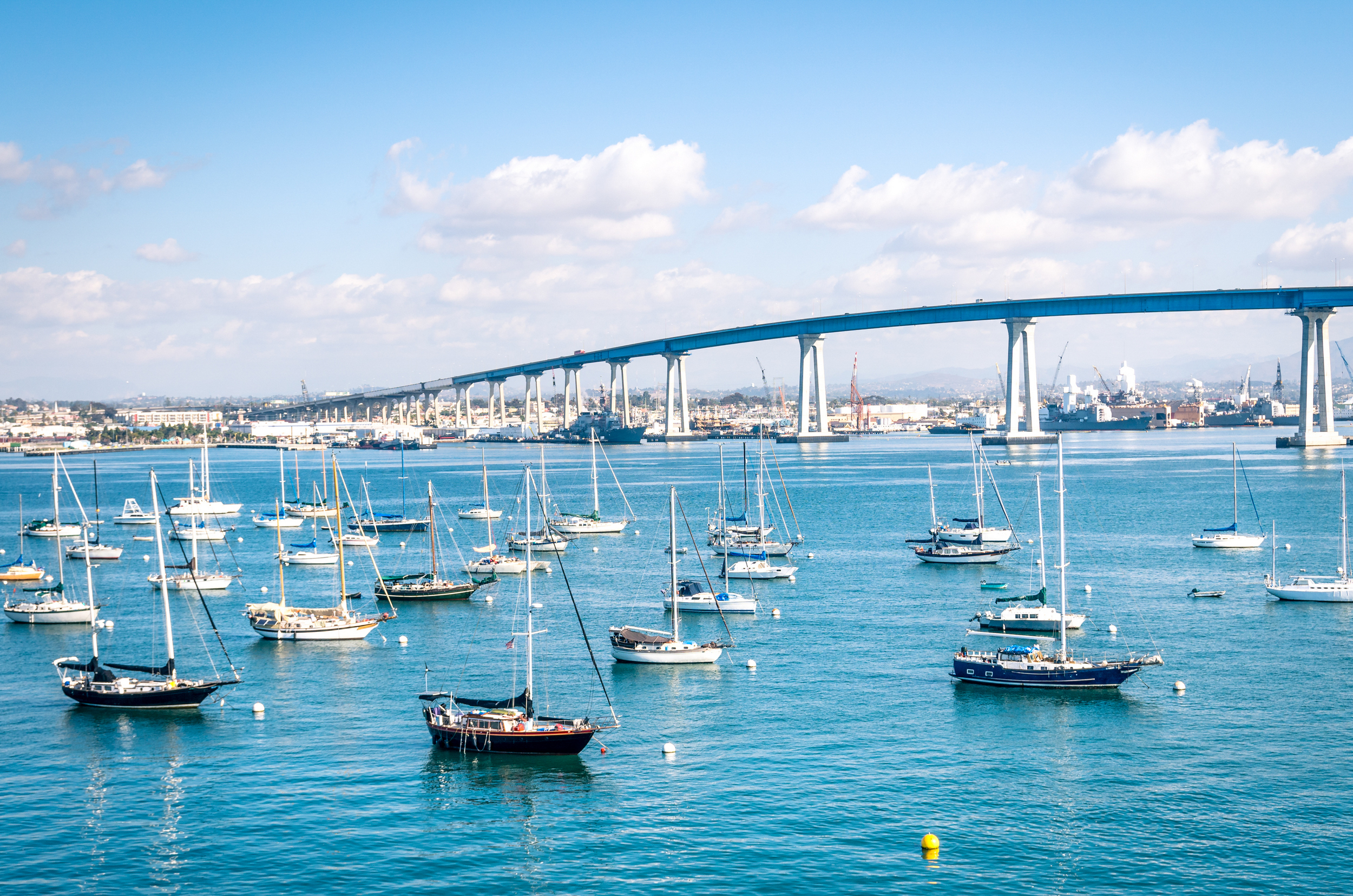 San Diego waterfront with sailing Boats - Indutrial harbor and Coronado Bridge