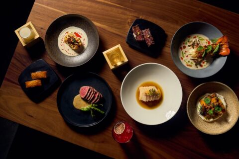 Many small plates on a wooden table