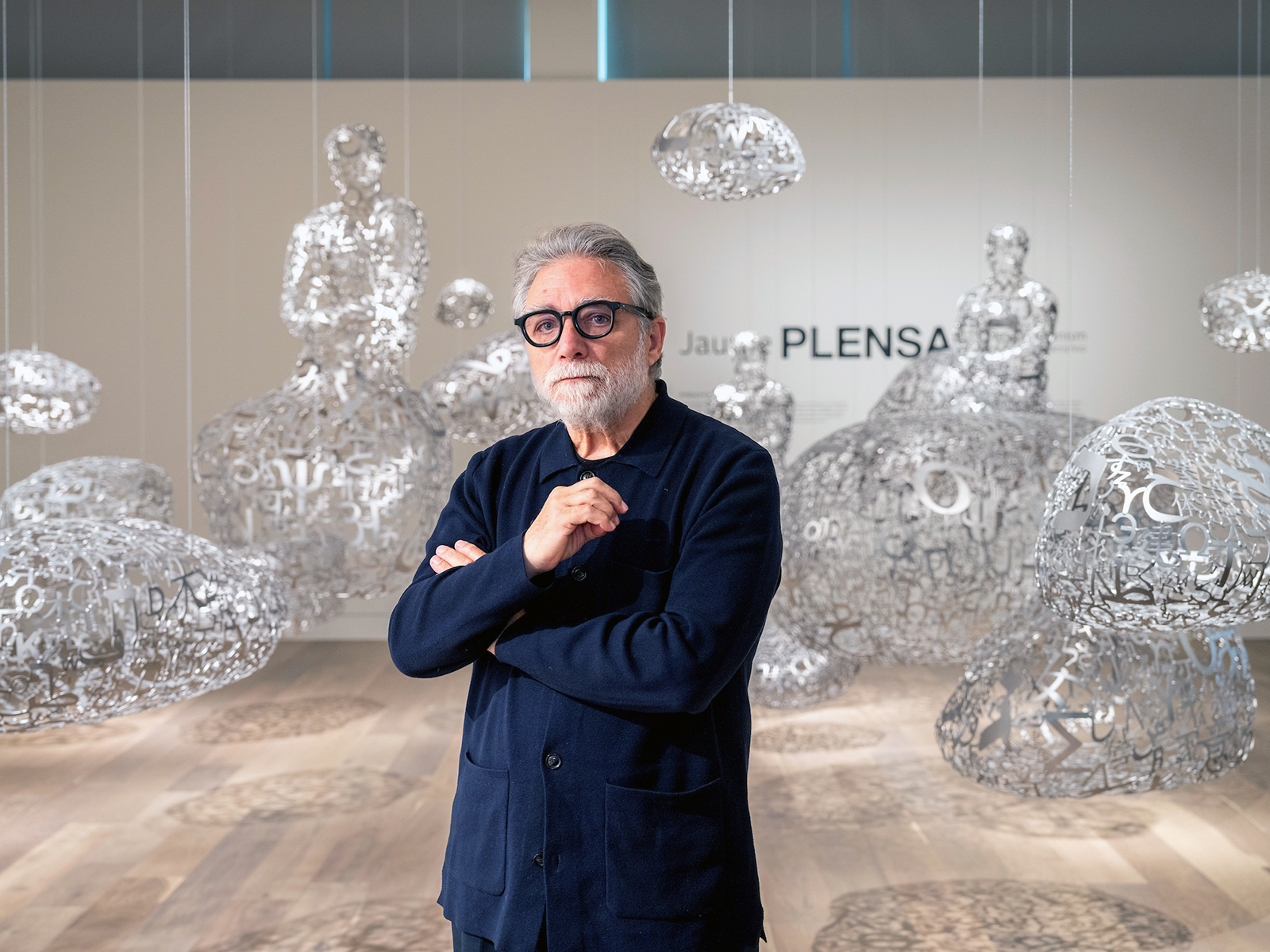 Jaume Plensa stands in a gallery within “Jaume Plensa: A New Humanism,” on display at the Denver Botanic Gardens