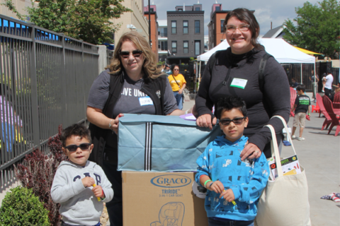 Two women and two children standing together outside