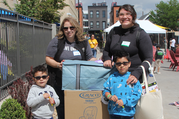 Two women and two children standing together outside