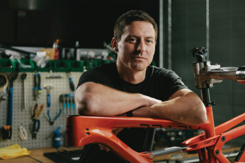 Adam Miller leaning on a Revel bike