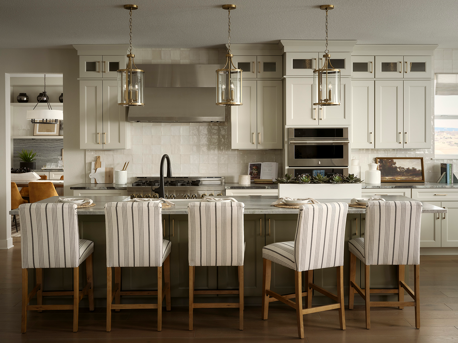 Kitchen with a large island and a long planter filled with succulents