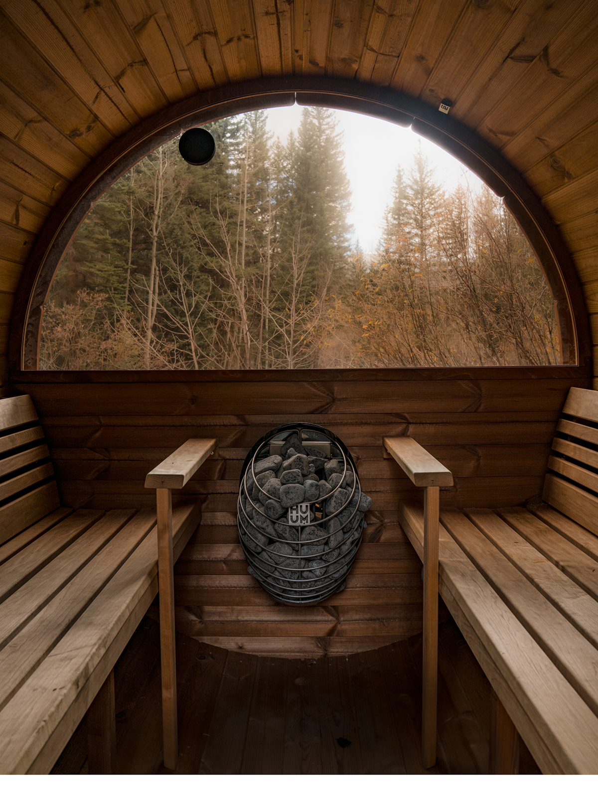 The wooden barrel sauna by Geneva Creek.