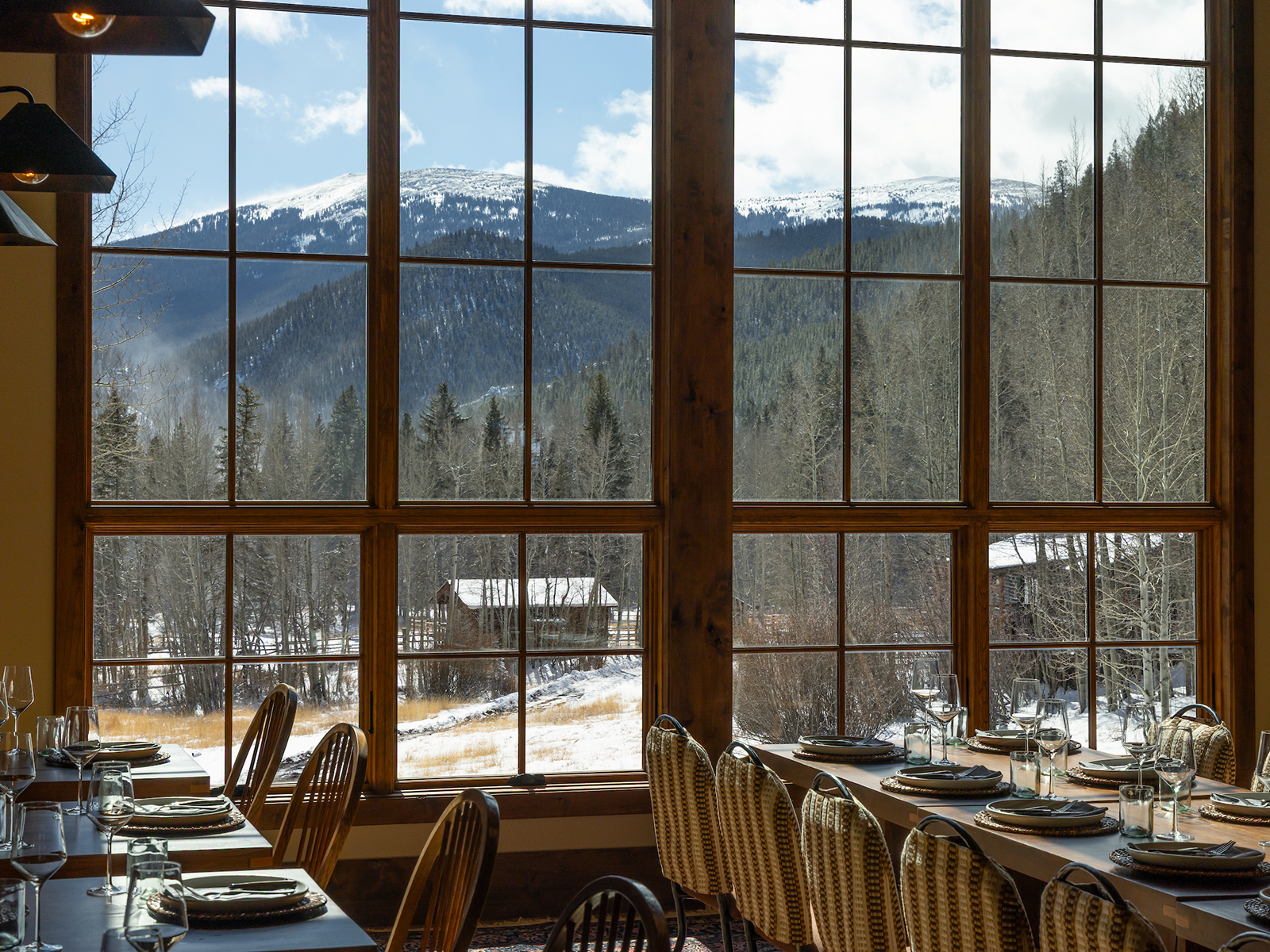 The large picture windows inside the lodge offer views of the Twin Cone Peaks.