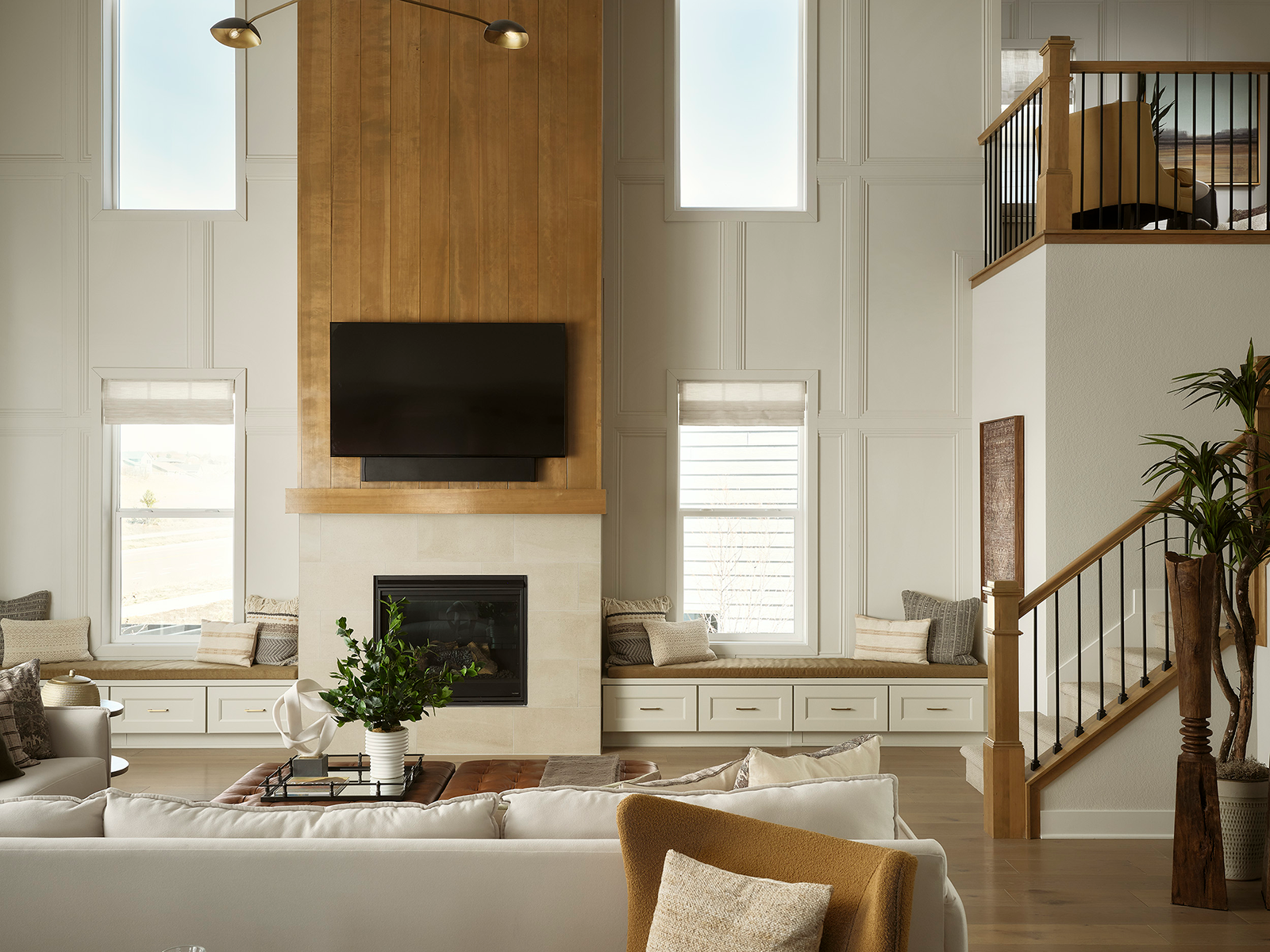 LIving room with a wood wall and greenery on the coffee table