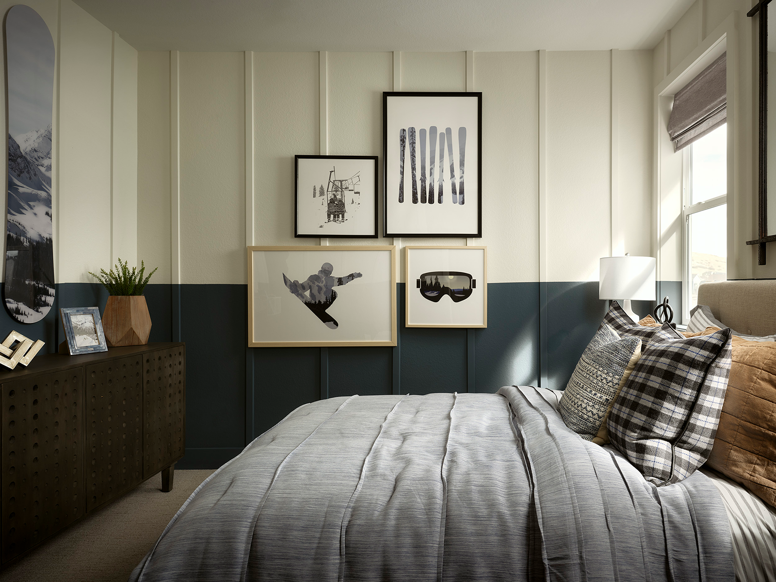 Bedroom filled with snowboarding photos