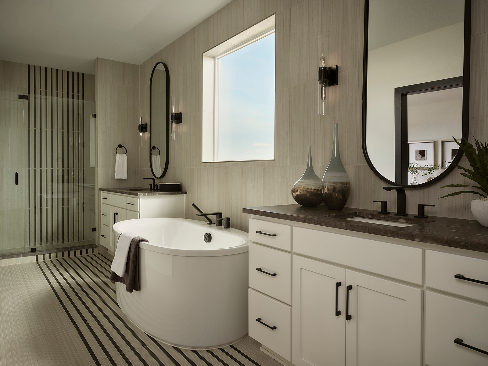 Primary bathroom with a large soaking tub beneath a window