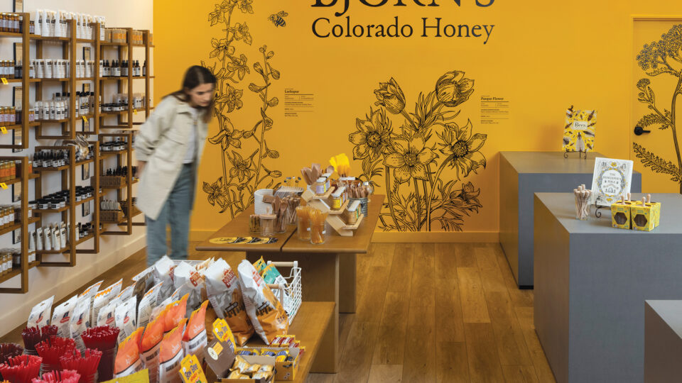 A woman inside Björn’s Colorado Honey cafe in DIA