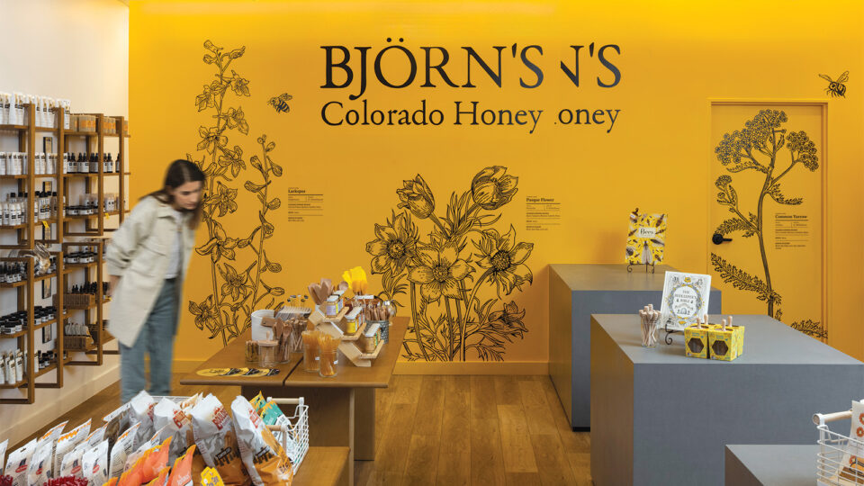 A woman inside Björn’s Colorado Honey cafe in DIA