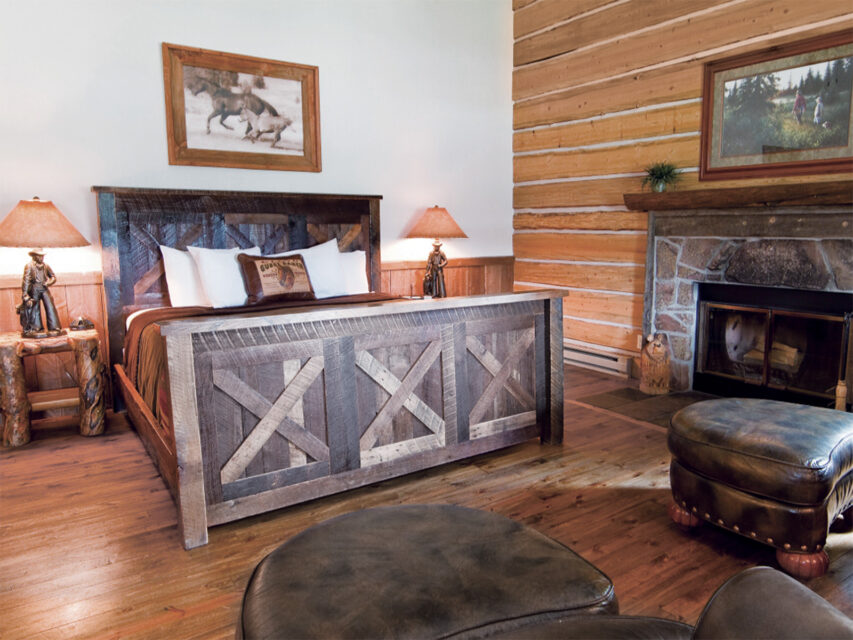 A cabin at C Lazy U Ranch with a bed and nightstands