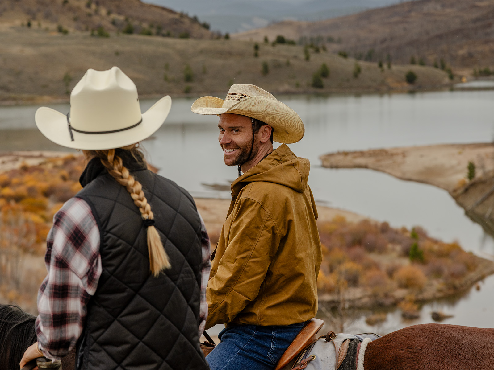 Two people riding horses at C Lazy U Ranch in Colorado