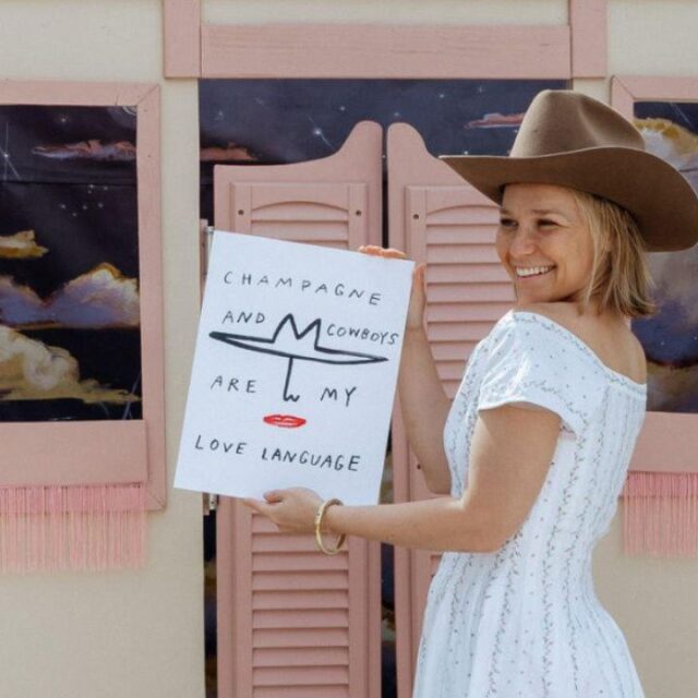 Ariana Barnstable with her work in front of "The Lazy Cowgirl Saloon," an installation piece she created with Lauren Young. Photo by Katie Puc