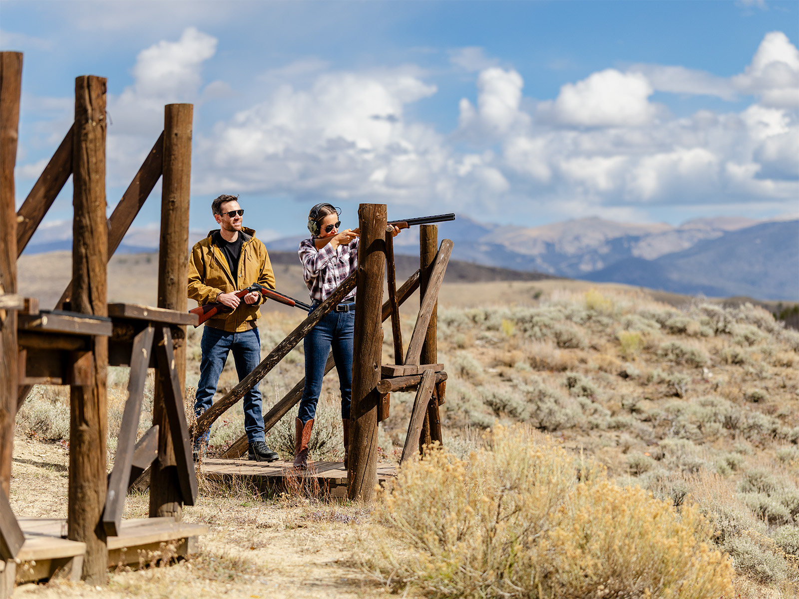 Two people trap shooting at C Lazy U Ranch in Colorado