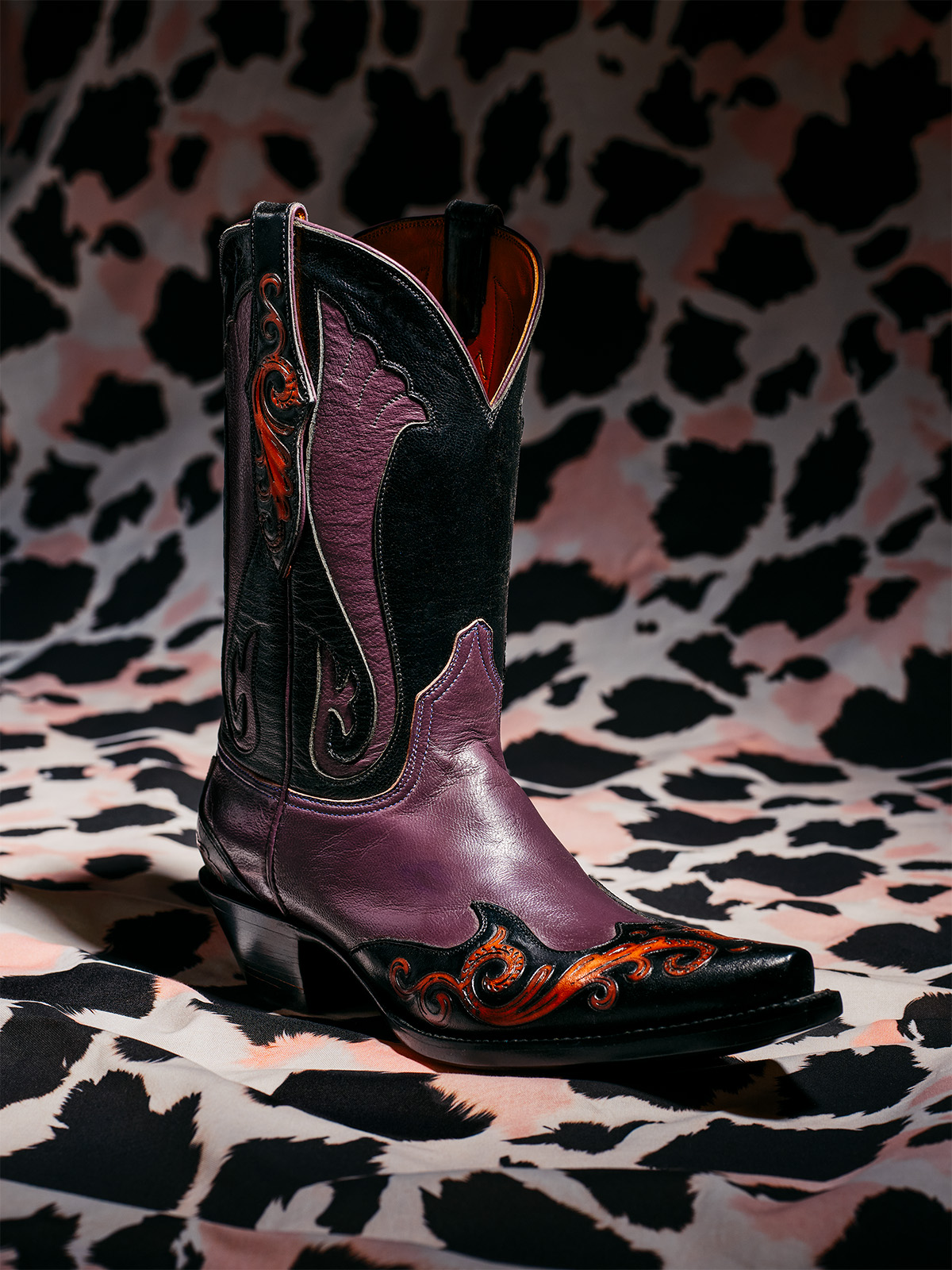 Black and purple cowboy boots from Lucky Bastard Custom Boots